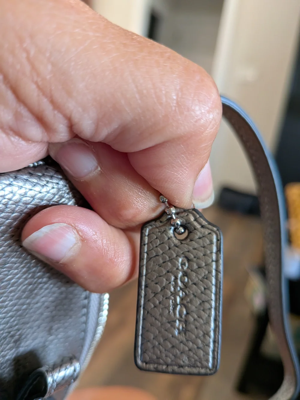 Coach Metallic Silver Bow-Accent Wristlet